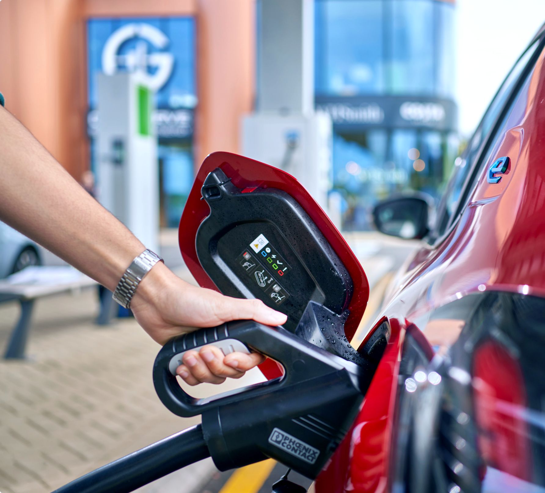 Recharging a red electric car at GRIDSERVE Electric Forecourt