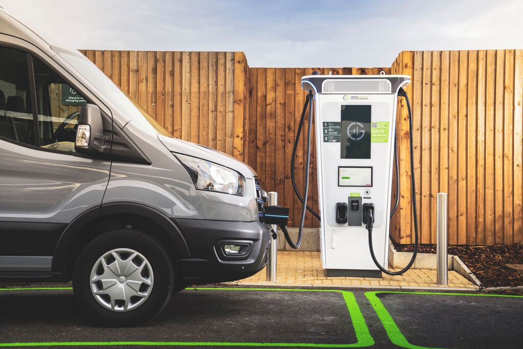 A fleet van charges at a GRIDSERVE Electric Forecourt